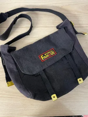 world famous faded messenger bag